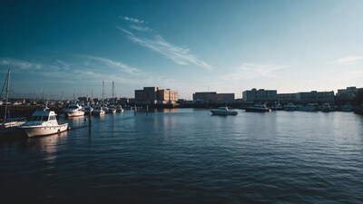 Boats docked in harbor at dusk