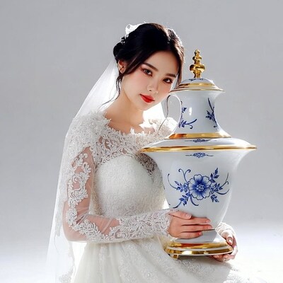 Asian Bride Holding Ornate Vase