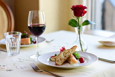 Romantic dinner table with red rose