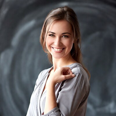 Smiling woman in gray blouse
