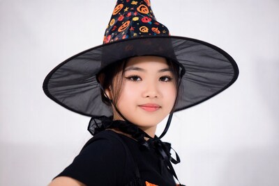 Asian girl in witch costume