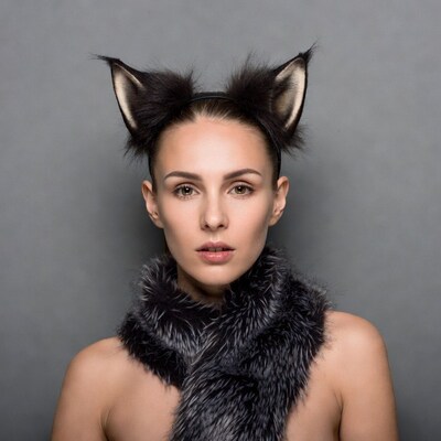 Woman with cat ears and fur scarf