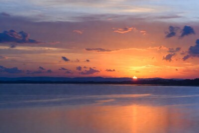 Sunset over calm lake
