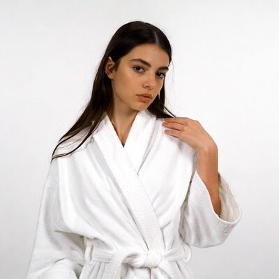 Woman in white bathrobe
