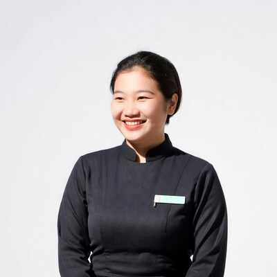 Asian woman in black uniform