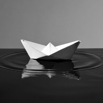 Paper boat on water