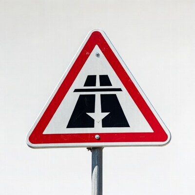 Road narrows ahead sign