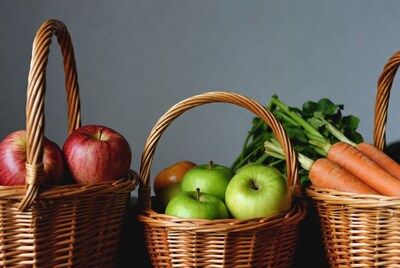 Baskets of apples and carrots