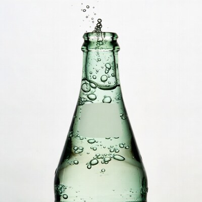 Green glass bottle with bubbles