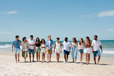 Group of friends walking on beach