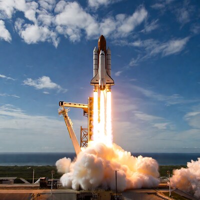 Space shuttle launching into sky