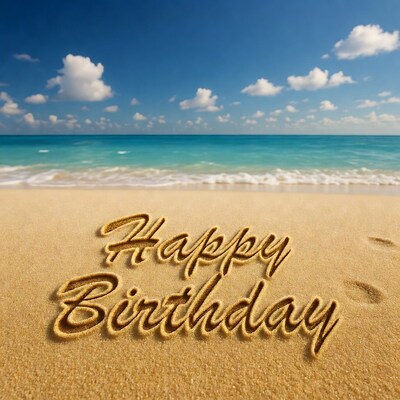 Happy Birthday written in sand