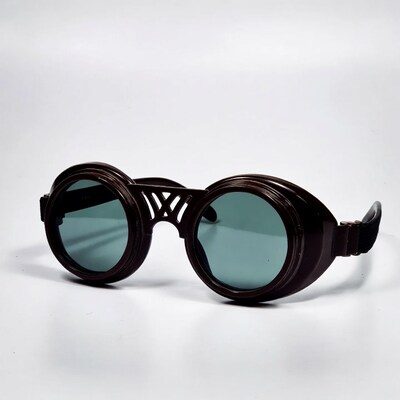 Round steampunk sunglasses on white background
