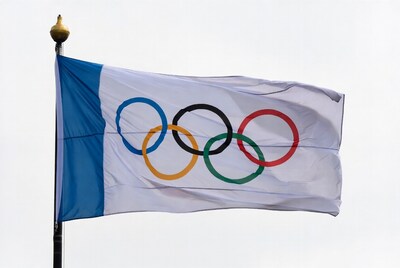 Olympic flag waving on pole