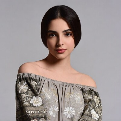 Woman with dark hair in floral top