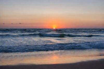 Sunset over ocean waves