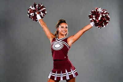 Cheerleader holding pom poms