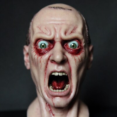 Horror zombie head with wide eyes