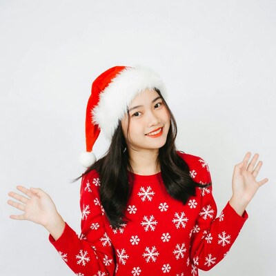 Asian woman in Santa hat