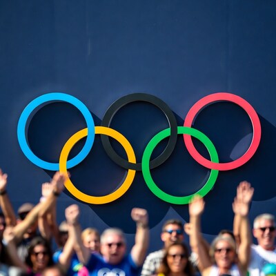 Olympic rings with cheering crowd