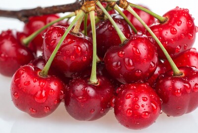 Fresh red cherries with water drops