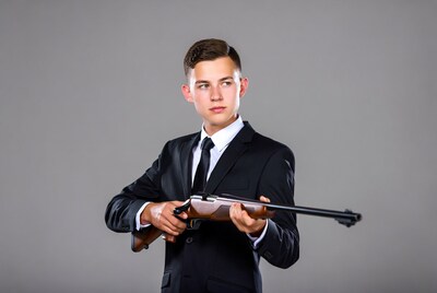 Young man holding a rifle