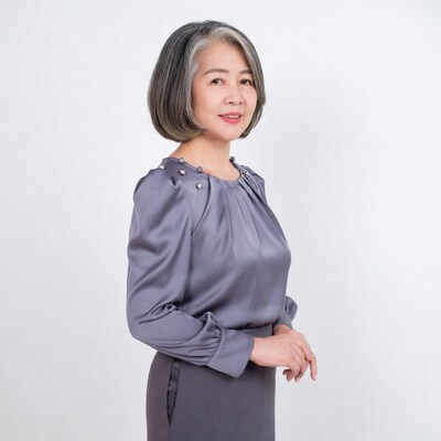 Asian woman in gray blouse