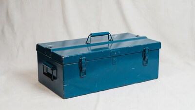 Blue metal toolbox on white background