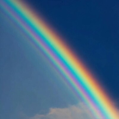 Rainbow in blue sky