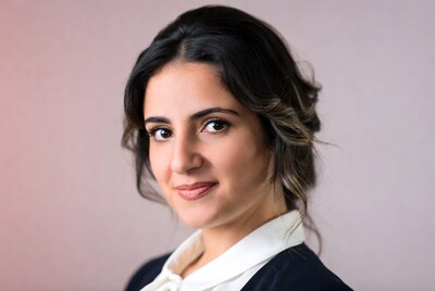 Woman with dark hair smiling