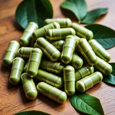 Green herbal capsules with leaves