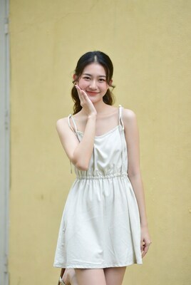 Young Asian woman in white dress