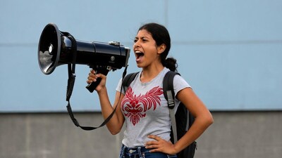 Woman shouting into megaphone