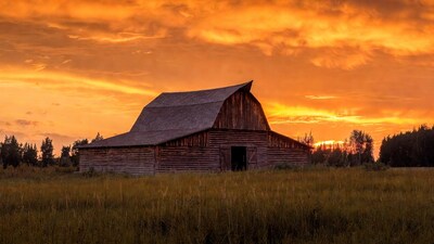 Old wooden barn at sunset