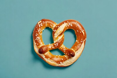 Soft pretzel on teal background