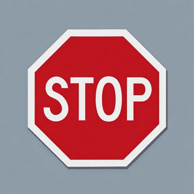 Red stop sign on gray background