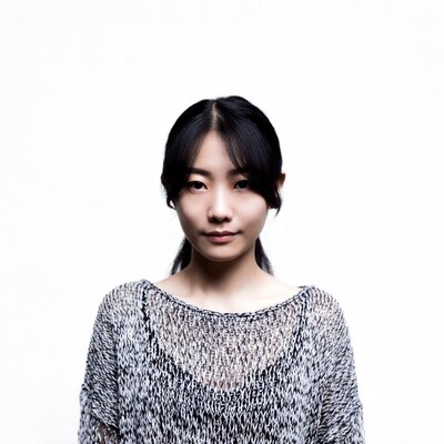 Asian woman in knit sweater