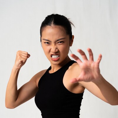 Asian woman in fighting stance