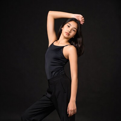 Asian woman posing in black outfit