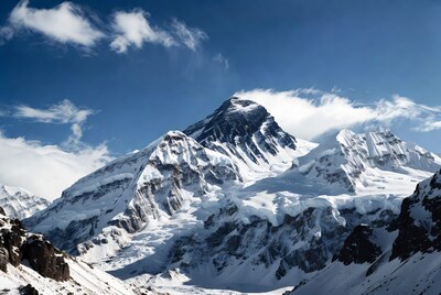 Snowy mountain peak under blue sky