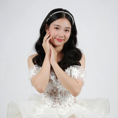 Asian woman in white dress