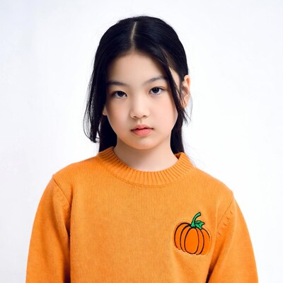 Asian girl in orange pumpkin sweater
