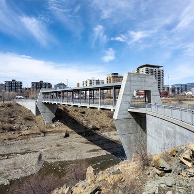 Concrete pedestrian bridge over river