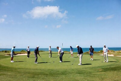 Men playing golf on green course