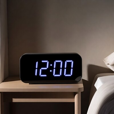 Digital clock showing 1200 on nightstand