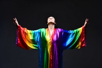 Woman in rainbow robe