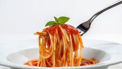 Spaghetti with tomato sauce on fork