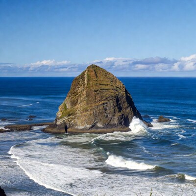 Rocky sea stack in ocean waves