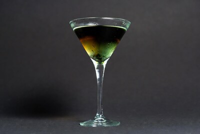 Layered cocktail in martini glass