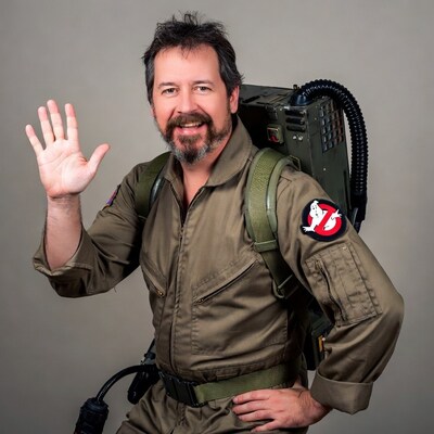 Man in Ghostbusters costume waving